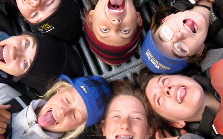 a group of outward bound students make silly faces at the camera